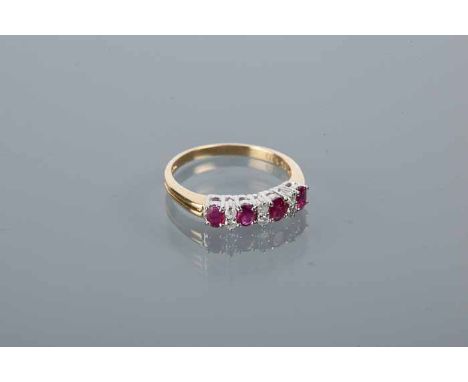 RUBY AND DIAMOND RING
set with four rubies interspersed by diamonds totalling 0.13 carats, hallmarked eighteen carat yellow g