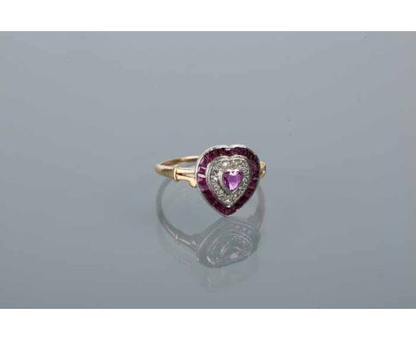 HEART SHAPED RUBY AND DIAMOND RING
set with a central rose cut ruby, surrounded by a row of diamonds and rubies, on bifurcate