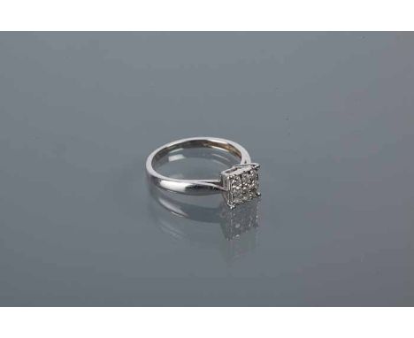 SQUARE BEZEL DIAMOND CLUSTER RING set with nine brilliant diamonds, hallmarked nine carat white gold, size K