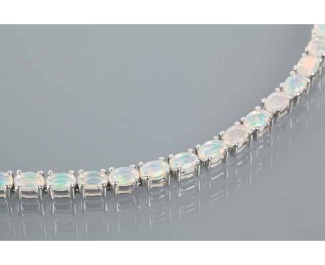 SILVER OPAL BRACELET
set with oval cut opals, each 6x4mm, marked "925", 24cm long