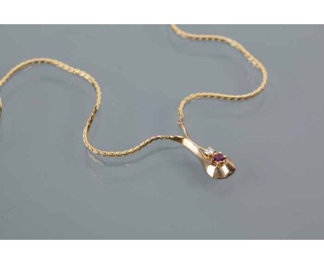 DIAMOND AND RUBY NECKLACE
formed as a drop set with a round emerald and brilliant cut diamond, marked "375" for nine carat go