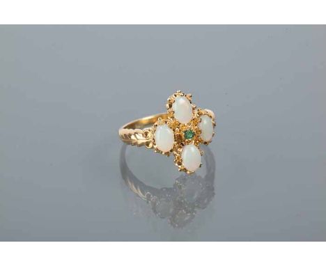 SYNTHETIC OPAL AND EMERALD RING
set with four oval cabochon synthetic opals, and a central round emerald, in silver gilt, siz