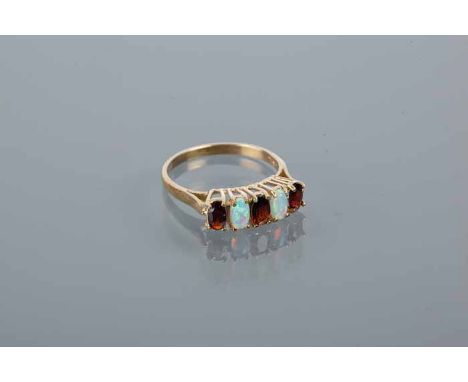 SYNTHETIC OPAL AND GARNET RING
set with alternating oval garnets and opals, in silver gilt, size N