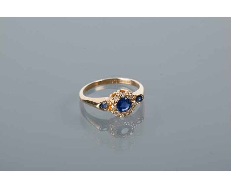 EDWARDIAN SAPPHIRE AND DIAMOND RING
the central sapphire surrounded by a cluster of brilliant cut diamonds, on sapphire set s