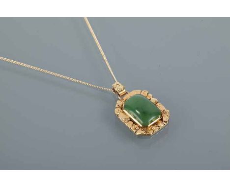 TEN CARAT GOLD JADE PENDANT
set with an emerald cabochon cut jade, setting marked "10K" for ten carat gold with applied gold 