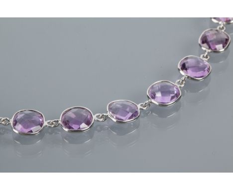 SILVER AMETHYST BRACELET set with nine faceted amethysts, marked "925", 18cm long, 9.8gms