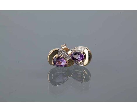 PAIR OF AMETHYST AND DIAMOND STUD EARRINGS
each with a pear shaped amethyst measuring 6.8mm x 3.9mm, in a diamond set nine ca