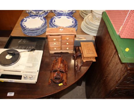 A set of miniature pine spice drawers; an artists lay doll; a wooden trinket box; an African face mask etc. 
