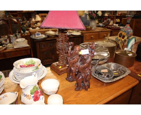 Two Chinese hard wood figures and similar table lamp and shade 