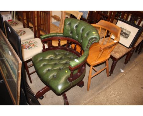 A green leather button down swivel desk chair 