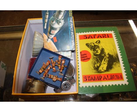 A Safari stamp album and contents; together with a box containing cigarette cards, a brass cased barometer etc.