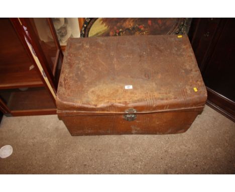 A tin trunk containing alabaster lamps etc. 