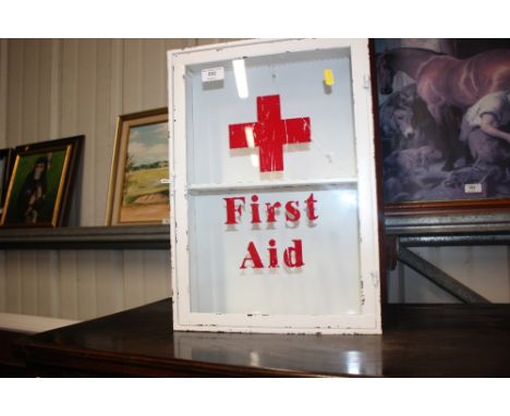 A metal and glazed First Aid cabinet 