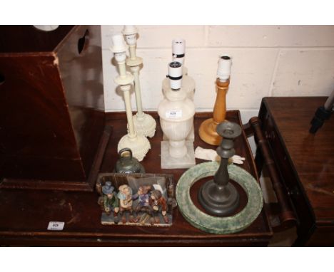 A quantity of various table lamp bases; and a pottery figure group 