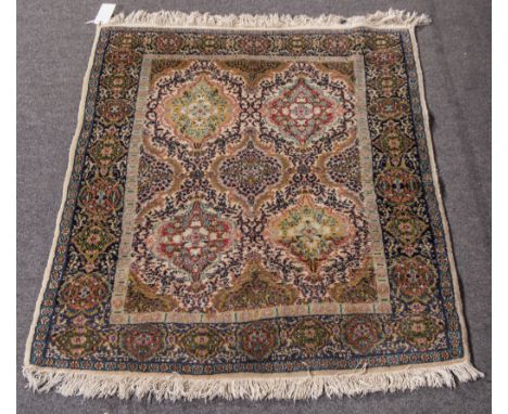 Isfahan style semi silk bordered rug, central panel with five tear drop guls and two half guls, multiple guls to the border o