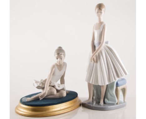 A pair of Nao ballerinas, on gilt plinths, 18cm, and a tall Nao ballerina, (3).