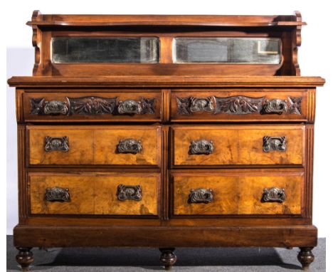 Late Victorian walnut sideboard, low back with a serpentine shelf over two mirror panels, faced with two banks of three drawe