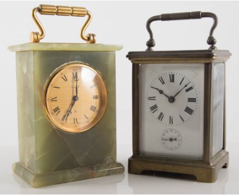 A brass cased carriage clock, enamelled dial with Roman numerals, height 14cms, another similar and an onyx cased Imhof mante