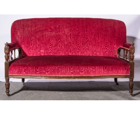 Victorian mahogany sofa, burgundy coloured upholstery, turned and reeded uprights, width 140cm.