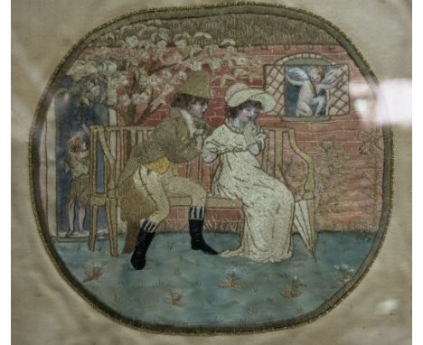 George III style embroidered silk picture, couple courting in a walled garden, oval panel within a rectangular frame, 21 x 23