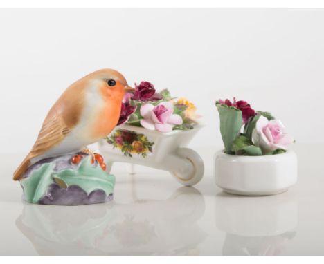 Locke & Co, Worcester miniature ewer, painted with a peacock, signed H. Wall, 7cms, Royal Worcester model of a robin, Royal C
