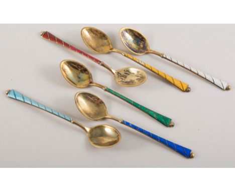 Set of six Danish silver gilt and enamel egg spoons, cased.