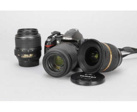 A Nikon D3000 DSLR Camera, with 55-200mm f/4-5.6 DX VR Nikor lens, 18-55mm f/3.5-5.6 DX Nikor lens, 10-24mm f3.5-4.5 Nikon fi