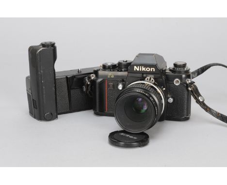 A Nikon F3 SLR Camera, black, serial no 1409822, shutter not working, body Fair to Good, some brassing and rubbing, together 