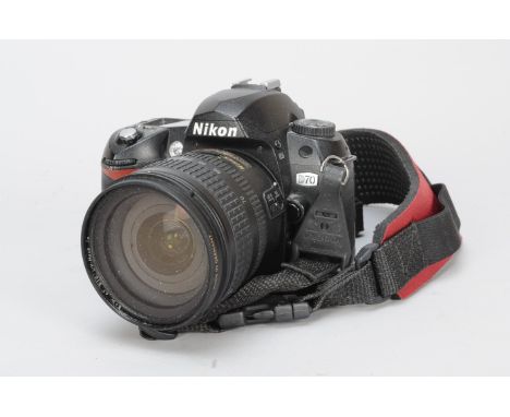 A Nikon D70 DSLR Camera, with AF-S Nikkor 18-70mm f/3.5-4.5G lens, battery, no charger, condition F, sticky grip, untested 