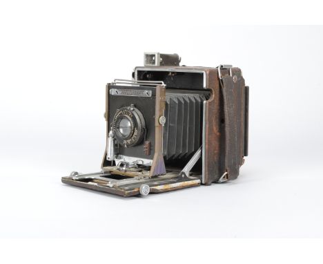 A Graflex Anniversary Speed Graphic Press Camera, with a 5 x 4in Graphic Film Holder Type 5, a Kodak Ektar 127mm f/4.7 lens, 