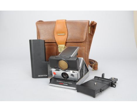 A Polaroid SX70 OneStep Folding SLR Instant Camera, with maker's case, a Polaroid Polatronic 2350 electronic flash and 2352 f