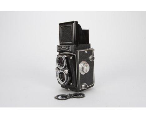 A Microflex TLR Camera, with 77.5mm f/3.5 lens, shutter button sticking, body VG, slight lifting to leatherette on front, ele