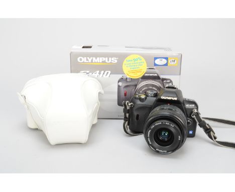 An Olympus E-410 DSLR Camera, with Zuiko digital 17.5-45mm f/3.5-5.6 lens, in makers box, with white leather Olympus case, un