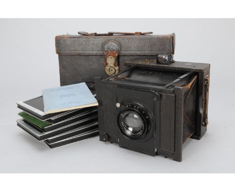 A Goertz Half Plate Camera, with 195mm f/4.5 Dogmar lens, shutter sticking, curtain creased, elements G, some fungus, body G,