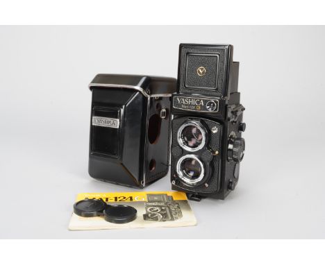 A Yashica Mat 124 G TLR Camera, with 80mm f/3.5 lens, shutter working, light meter responsive, body VG, elements G, some fung