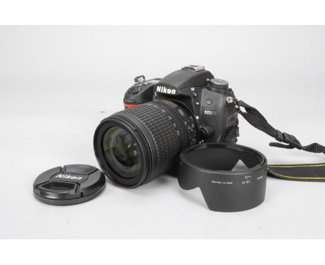 A Nikon D7000 DSLR Camera, serial no 6567188, with an AF-S Nikkor 18-105mm f/3.5-5.6G VR ED DX lens, with instructions, 2 mem