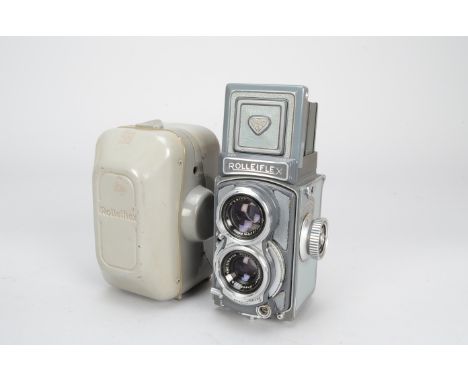 A Rolleiflex Grey Baby 4cm x 4cm TLR Camera, serial no 2005662, body F-G, some rubbing to side fabric, shutter working, with 