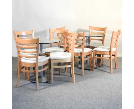 Two circular glass top tables, together with eight ladder back chairs70cm dia x 73cm high