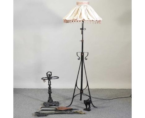 A black painted iron telescopic standard lamp and shade, together with a stick stand, fire tools and other items