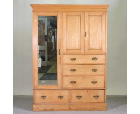 An Edwardian light ash combination wardrobe, on a plinth base150w x 59d x 207h cm