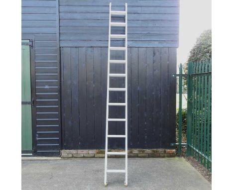 An aluminium extending ladder, 694cm long overall