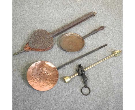 A pair of 19th century carved wooden bellows, 97cm long, together with a set of brass scales and two copper skimmers (4)