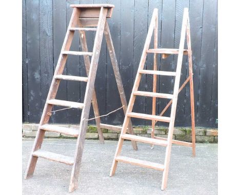 A wooden step ladder, 149cm high, together with another smaller (2)
