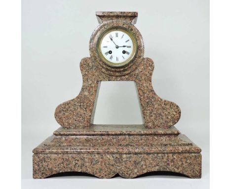A large pink granite cased mantel clock, with a white enamel dial and eight day movement, 45cm high