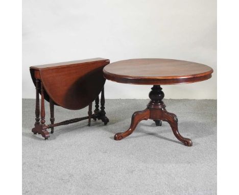 A Victorian mahogany breakfast table, on a tripod base,100cm diameter, together with a Victorian mahogany sutherland table (2