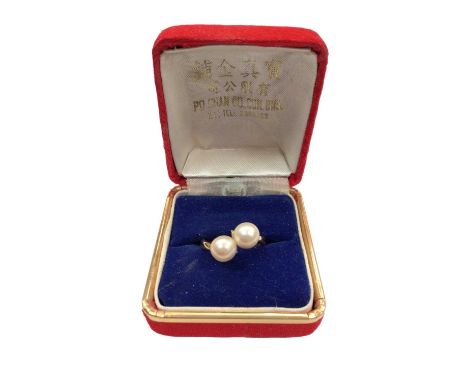 Chinese yellow metal double cultured pearl ring, size O½Shank stamped 835 and Chinese charcater marks.Weight 6 grams