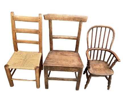19th century child's stick back chair, a caned ladder back chair and a primitive oak chair. (3)