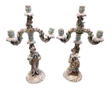 Pair of 19th century Dresden figural porcelain candelabra with floral encrusted decoration, 50cm high The woman's head has be