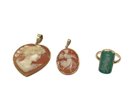 Two carved cameos in 18ct gold pendant mounts and a yellow metal cameo ring, size E½ (3)Two pendants weigh 4.9 grams Ring is 