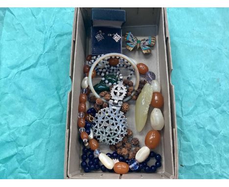 Group of jewellery including an amber necklace, Chinese carvings, Chinese silver earrings, etc